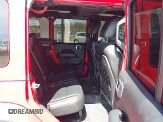 2020 Jeep Wrangler Unlimited Rubicon with VIN 1C4HJXFG9LW106607, listed as a IAAI auction lot 41908295 with 71,083 mi miles and . Bid and sale history available at DreamBid. Image 8.