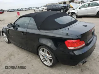 2013 BMW 1 Series 135i with VIN WBAUN7C58DVM26978, listed as a Copart auction lot 77974834 with 0 mi miles and Clean Title. Bid and sale history available at carsss.com. Image 2.
