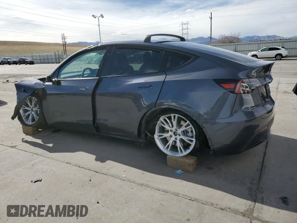 2023 Tesla Model Y Long Range with VIN 7SAYGAEE4PF873757, listed as a Copart auction lot 49530325 with 16,238 mi miles and Salvage Title. Bid and sale history available at DreamBid. Image 2.