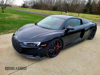 2021 Audi R8 z VIN WUAKBAFX4M7901384, wystawiony jako Copart lot #81273994 z przebiegiem 5665 mil mil oraz Tytuł czysty. Historia ofert i sprzedaży dostępna na DreamBid. Obrazek 2.