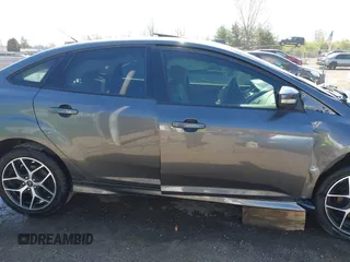 2015 Ford Focus SE with VIN 1FADP3F29FL268677, listed as a IAAI auction lot 42037244 with 118,018 mi miles. Bid and sale history available at carsss.com. Image 14.