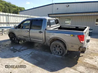 2015 Nissan Titan SL with VIN 1N6BA0EC5FN509230, listed as a Copart auction lot 73983574 with 144,288 mi miles and Salvage Title. Bid and sale history available at carsss.com. Image 2.