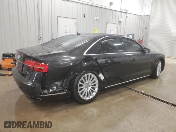 2015 Audi A8 4.0T z VIN WAUJ2AFD5FN009882, wystawiony jako Copart lot #84222704 z przebiegiem 56 118 mil mil oraz Czysty tytuł • Clean title. Historia ofert i sprzedaży dostępna na DreamBid. Obrazek 3.