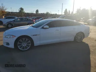 2012 Jaguar XJ Supercharged with VIN SAJWA2GE1CMV27418, listed as a Copart auction lot 82669564 with 86,797 mi miles and Salvage title. Bid and sale history available at DreamBid. Image 1.