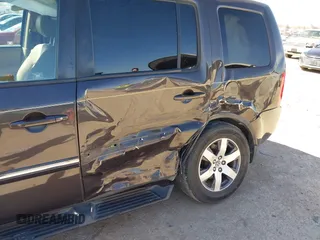 2012 Honda Pilot Touring with VIN 5FNYF4H99CB069996, listed as a IAAI auction lot 41809046 with 140,836 mi miles and . Bid and sale history available at DreamBid. Image 6.