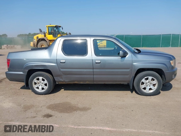 2009 Honda Ridgeline RTS z VIN 5FPYK16479B107114, wystawiony jako IAAI lot #42452199 z przebiegiem 206 853 mil mil oraz . Historia ofert i sprzedaży dostępna na DreamBid. Obrazek 13.