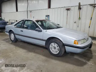 1990 Ford Thunderbird with VIN 1FAPP6047LH140817, listed as a Copart auction lot 83910194 with 177,909 mi miles and Salvage Title. Bid and sale history available at DreamBid. Image 4.