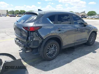 2020 Mazda CX-5 Touring with VIN JM3KFACM9L0826742, listed as a IAAI auction lot 41903755 with 73,409 mi miles and . Bid and sale history available at DreamBid. Image 4.