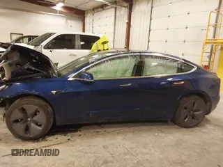 2018 Tesla Model 3 Long Range Battery with VIN 5YJ3E1EB7JF086201, listed as a IAAI auction lot 41965193 with 99,231 mi miles and . Bid and sale history available at DreamBid. Image 14.