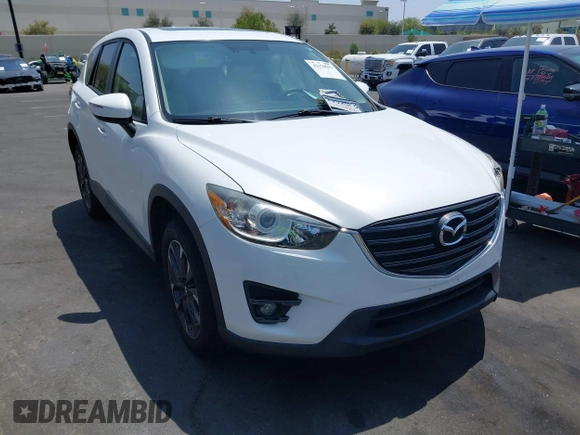 2016 Mazda CX-5 Grand Touring z VIN JM3KE2DY2G0824802, wystawiony jako IAAI lot #42170591 z przebiegiem 53 173 mil mil oraz . Historia ofert i sprzedaży dostępna na DreamBid. Obrazek 1.