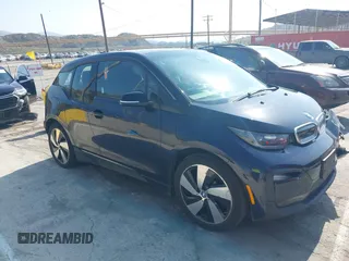 2018 BMW i3 z VIN WBY7Z4C55JVD95348, wystawiony jako IAAI lot #42403528 z przebiegiem 122 592 mil mil oraz . Historia ofert i sprzedaży dostępna na DreamBid. Obrazek 1.