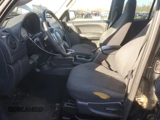 2003 Jeep Liberty Sport with VIN 1J4GK48KX3W658457, listed as a Copart auction lot 41863855 with 194,747 mi miles and Salvage Title. Bid and sale history available at DreamBid. Image 7.