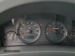 2005 Jeep Grand Cherokee Laredo with VIN 1J4GR48KX5C565762, listed as a Copart auction lot 63080115 with 122,349 mi miles and Salvage title. Bid and sale history available at DreamBid. Image 9.