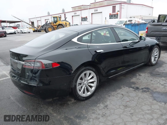 2016 Tesla Model S 70 with VIN 5YJSA1E1XGF154577, listed as a IAAI auction lot 41778697 with 62,630 mi miles and . Bid and sale history available at DreamBid. Image 4.