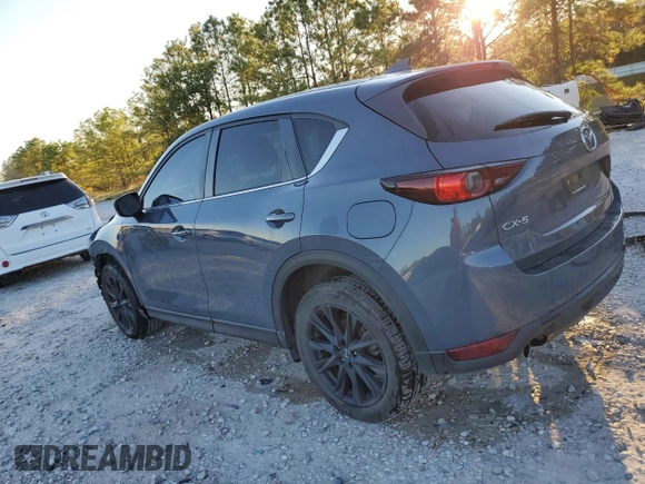 2021 Mazda CX-5 Touring with VIN JM3KFACM3M0387734, listed as a Copart auction lot 79894294 with 65,819 mi miles and Clean Title. Bid and sale history available at carsss.com. Image 2.
