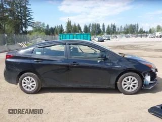 2021 Toyota Prius L Eco with VIN JTDKAMFU3M3140233, listed as a IAAI auction lot 42182685 with 38,842 mi miles and . Bid and sale history available at DreamBid. Image 14.