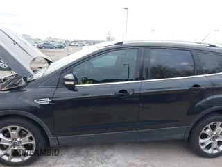 2015 Ford Escape Titanium with VIN 1FMCU9J96FUA27221, listed as a IAAI auction lot 41925276 with 180,758 mi miles and . Bid and sale history available at carsss.com. Image 6.