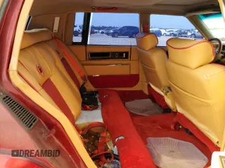 1991 Cadillac DeVille z VIN 1G6CD53B2M4335645, wystawiony jako Copart lot #53390805 z przebiegiem 210 451 mil mil oraz Szkoda całkowita • Salvage title. Historia ofert i sprzedaży dostępna na DreamBid. Obrazek 10.
