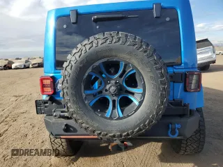 2015 Jeep Wrangler Unlimited Altitude with VIN 1C4BJWEG1FL514848, listed as a Copart auction lot 86474114 with 84,349 mi miles and Salvage title. Bid and sale history available at DreamBid. Image 6.