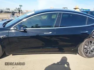 2018 Tesla Model 3 Long Range Battery with VIN 5YJ3E1EA0JF056979, listed as a IAAI auction lot 41865849 with 97,319 mi miles. Bid and sale history available at carsss.com. Image 14.