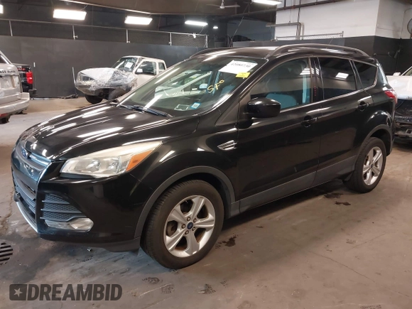 2014 Ford Escape SE with VIN 1FMCU0GX6EUE31877, listed as a IAAI auction lot 42080730 with 71,251 mi miles. Bid and sale history available at carsss.com. Image 2.