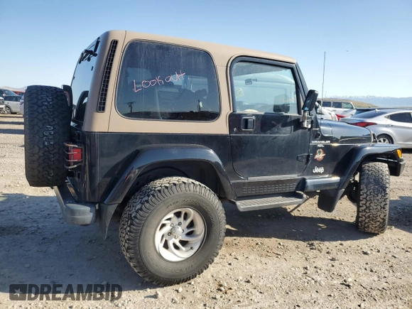 1999 Jeep Wrangler Sahara with VIN 1J4FY49S9XP479545, listed as a Copart auction lot 54753745 with 34,642 mi miles and Salvage title. Bid and sale history available at DreamBid. Image 3.