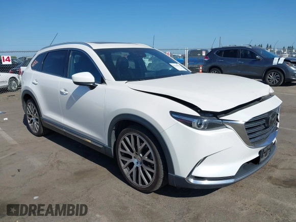 2017 Mazda CX-9 Grand Touring with VIN JM3TCBDY3H0132351, listed as a IAAI auction lot 42346910 with 124,990 mi miles and . Bid and sale history available at DreamBid. Image 1.