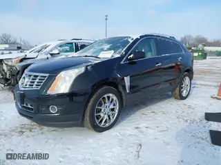 2014 Cadillac SRX Performance Collection with VIN 3GYFNFE39ES661344, listed as a IAAI auction lot 41619214 with NaN miles. Bid and sale history available at carsss.com. Image 17.