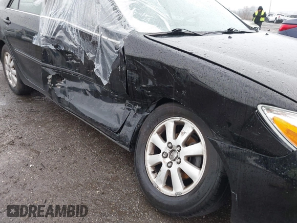 2003 Toyota Camry LE with VIN 4T1BE30K13U144114, listed as a IAAI auction lot 41829879 with 60,385 mi miles and . Bid and sale history available at DreamBid. Image 6.