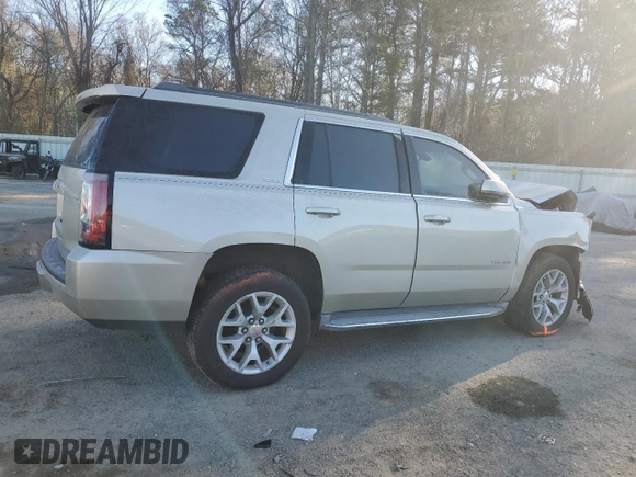 2015 GMC Yukon SLE with VIN 1GKS1AKC4FR265208, listed as a Copart auction lot 42324245 with 105,760 mi miles and Salvage Title. Bid and sale history available at carsss.com. Image 3.