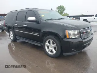 2011 Chevrolet Suburban LTZ with VIN 1GNSKKE32BR100379, listed as a IAAI auction lot 42115686 with 174,830 mi miles. Bid and sale history available at carsss.com. Image 1.