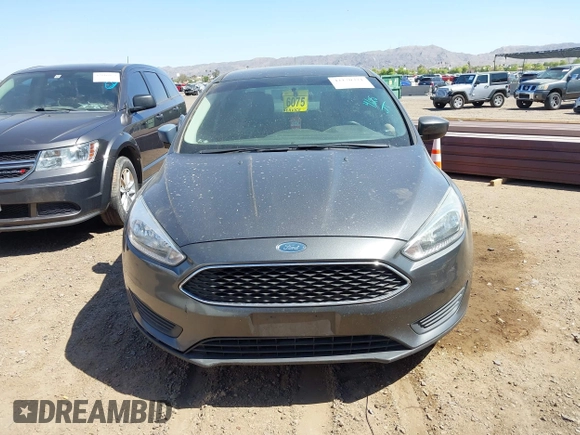 2018 Ford Focus SE with VIN 1FADP3FE6JL270910, listed as a IAAI auction lot 42130371 with 121,240 mi miles. Bid and sale history available at carsss.com. Image 12.