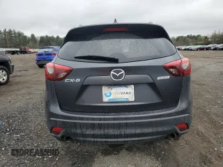2016 Mazda CX-5 Grand Touring z VIN JM3KE2DY9G0687261, wystawiony jako Copart lot #52865415 z przebiegiem Nie podano mil oraz Szkoda całkowita • Salvage title. Historia ofert i sprzedaży dostępna na DreamBid. Obrazek 6.