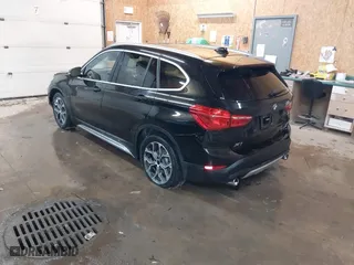 2020 BMW X1 xDrive28i with VIN WBXJG9C07L5P71792, listed as a IAAI auction lot 41583132 with 150,095 mi miles. Bid and sale history available at carsss.com. Image 3.