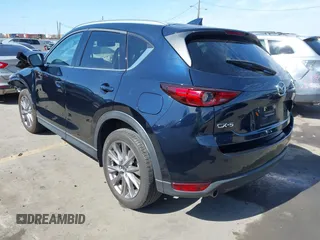 2020 Mazda CX-5 Grand Touring with VIN JM3KFADM6L1830093, listed as a IAAI auction lot 41699672 with 66,769 mi miles. Bid and sale history available at carsss.com. Image 3.