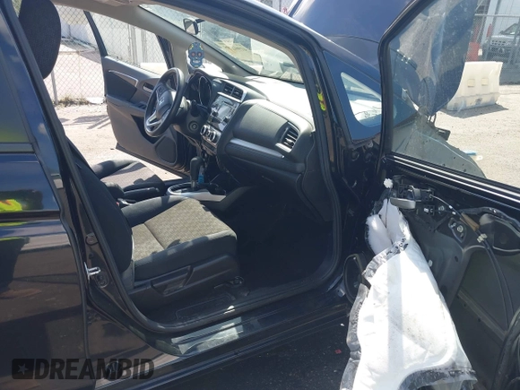 2016 Honda Fit LX with VIN JHMGK5H57GS010902, listed as a IAAI auction lot 41902395 with 124,531 mi miles. Bid and sale history available at carsss.com. Image 5.