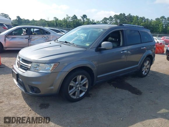 2012 Dodge Journey Crew with VIN 3C4PDCDG9CT199567, listed as a IAAI auction lot 42738030 with 140,864 mi miles and . Bid and sale history available at DreamBid. Image 2.