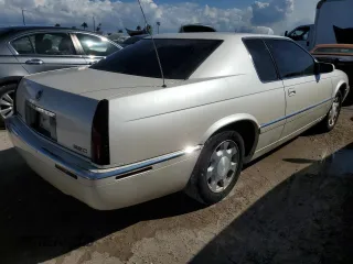 2000 Cadillac Eldorado z VIN 1G6EL12Y0YB704658, wystawiony jako Copart lot #77596814 z przebiegiem Nie podano mil oraz Nie do naprawy • Non repairable. Historia ofert i sprzedaży dostępna na DreamBid. Obrazek 3.
