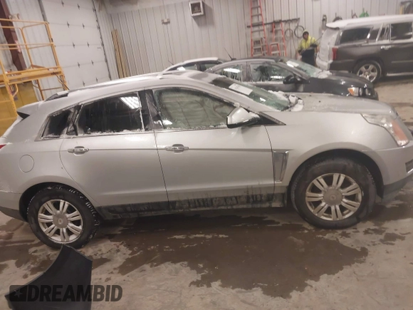 2016 Cadillac SRX Luxury Collection z VIN 3GYFNBE36GS572780, wystawiony jako IAAI lot #41347399 z przebiegiem 166 436 mil mil oraz . Historia ofert i sprzedaży dostępna na DreamBid. Obrazek 13.