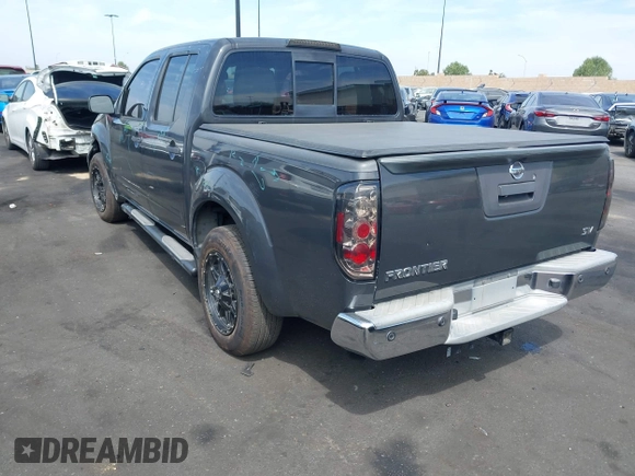 2014 Nissan Frontier SV with VIN 1N6AD0ER8EN756702, listed as a IAAI auction lot 42021294 with 135,143 mi miles and . Bid and sale history available at DreamBid. Image 3.