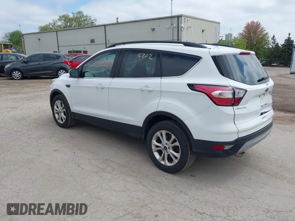 2018 Ford Escape SE z VIN 1FMCU9GDXJUC99453, wystawiony jako IAAI lot #42195202 z przebiegiem 191 840 mil mil oraz . Historia ofert i sprzedaży dostępna na DreamBid. Obrazek 3.
