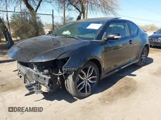 2016 Scion tC z VIN JTKJF5C7XGJ017894, wystawiony jako IAAI lot #41614948 z przebiegiem 109 311 mil mil oraz . Historia ofert i sprzedaży dostępna na DreamBid. Obrazek 2.