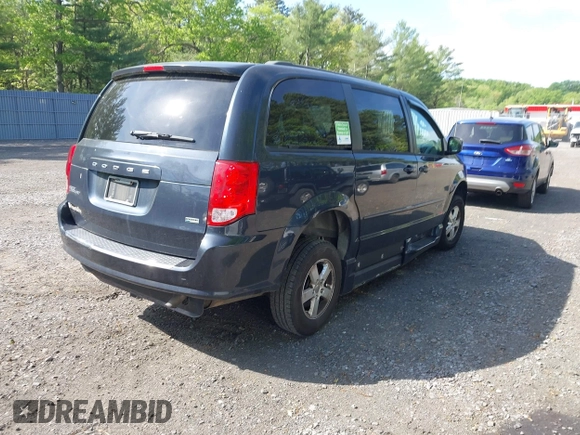 2013 Dodge Grand Caravan SXT with VIN 2C4RDGCG4DR636798, listed as a IAAI auction lot 42240550 with 96,100 mi miles and . Bid and sale history available at DreamBid. Image 4.