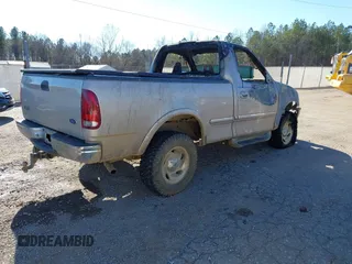 1998 Ford F-150 with VIN 1FTRF18L9WNA48859, listed as a IAAI auction lot 41287410 with Not provided miles and . Bid and sale history available at DreamBid. Image 4.