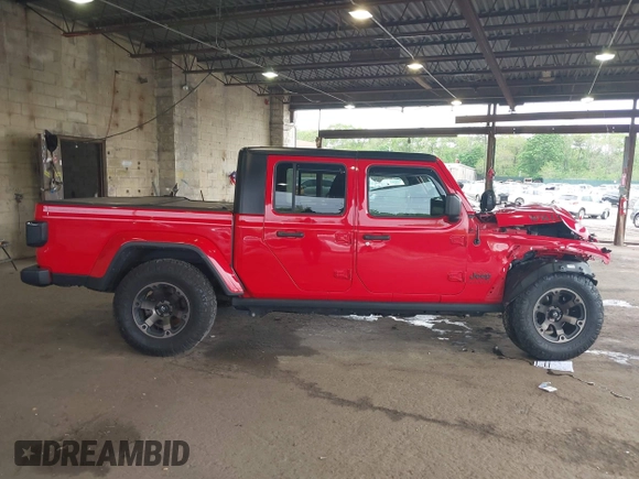 2021 Jeep Gladiator Willys with VIN 1C6HJTAG7ML602130, listed as a IAAI auction lot 42161745 with 49,576 mi miles and . Bid and sale history available at DreamBid. Image 14.