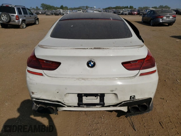 2015 BMW M6 z VIN WBS6C9C51FD467998, wystawiony jako Copart lot #67775934 z przebiegiem Nie podano mil oraz Szkody całkowita. Historia ofert i sprzedaży dostępna na DreamBid. Obrazek 6.