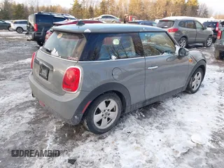 2019 MINI Hardtop Cooper with VIN WMWXP5C52K2H91038, listed as a IAAI auction lot 41509304 with 77,123 mi miles and . Bid and sale history available at DreamBid. Image 4.