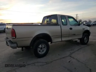 1999 Ford F-150 z VIN 2FTRX18W3XCA06671, wystawiony jako Copart lot #85561784 z przebiegiem 100 579 mil mil oraz Szkoda całkowita • Salvage title. Historia ofert i sprzedaży dostępna na DreamBid. Obrazek 3.