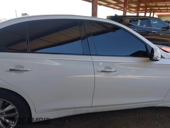2015 Infiniti Q50 Premium z VIN JN1BV7AP4FM353666, wystawiony jako IAAI lot #42289579 z przebiegiem 96 894 mil mil oraz . Historia ofert i sprzedaży dostępna na DreamBid. Obrazek 13.