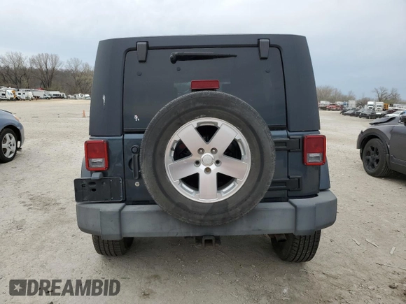 2007 Jeep Wrangler Unlimited Sahara z VIN 1J4GB59147L165439, wystawiony jako Copart lot #50794065 z przebiegiem 255 385 mil mil oraz Szkoda całkowita • Salvage title. Historia ofert i sprzedaży dostępna na DreamBid. Obrazek 6.